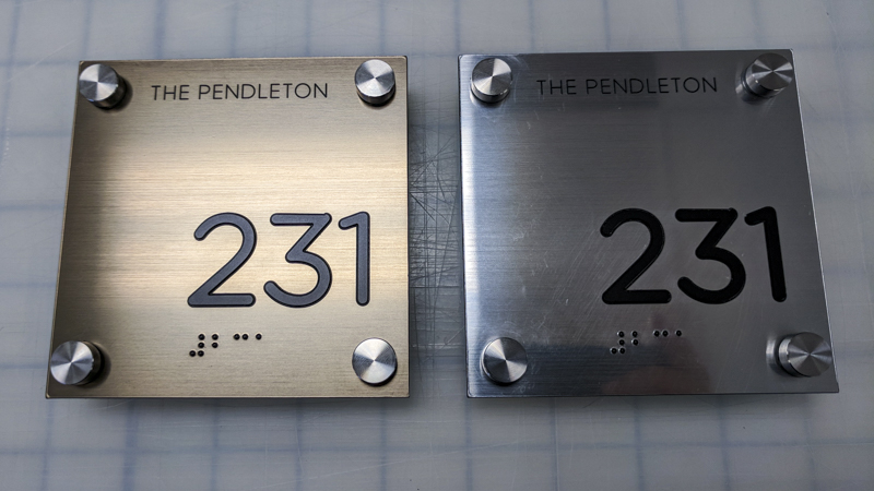  ADA compliant room number signage. Engineered, fabricated and installed by Signgeek. 
