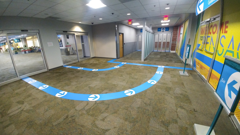 Interior wayfinding and floor graphics for Pensacola International Airport - signgeek Environmental Graphics 