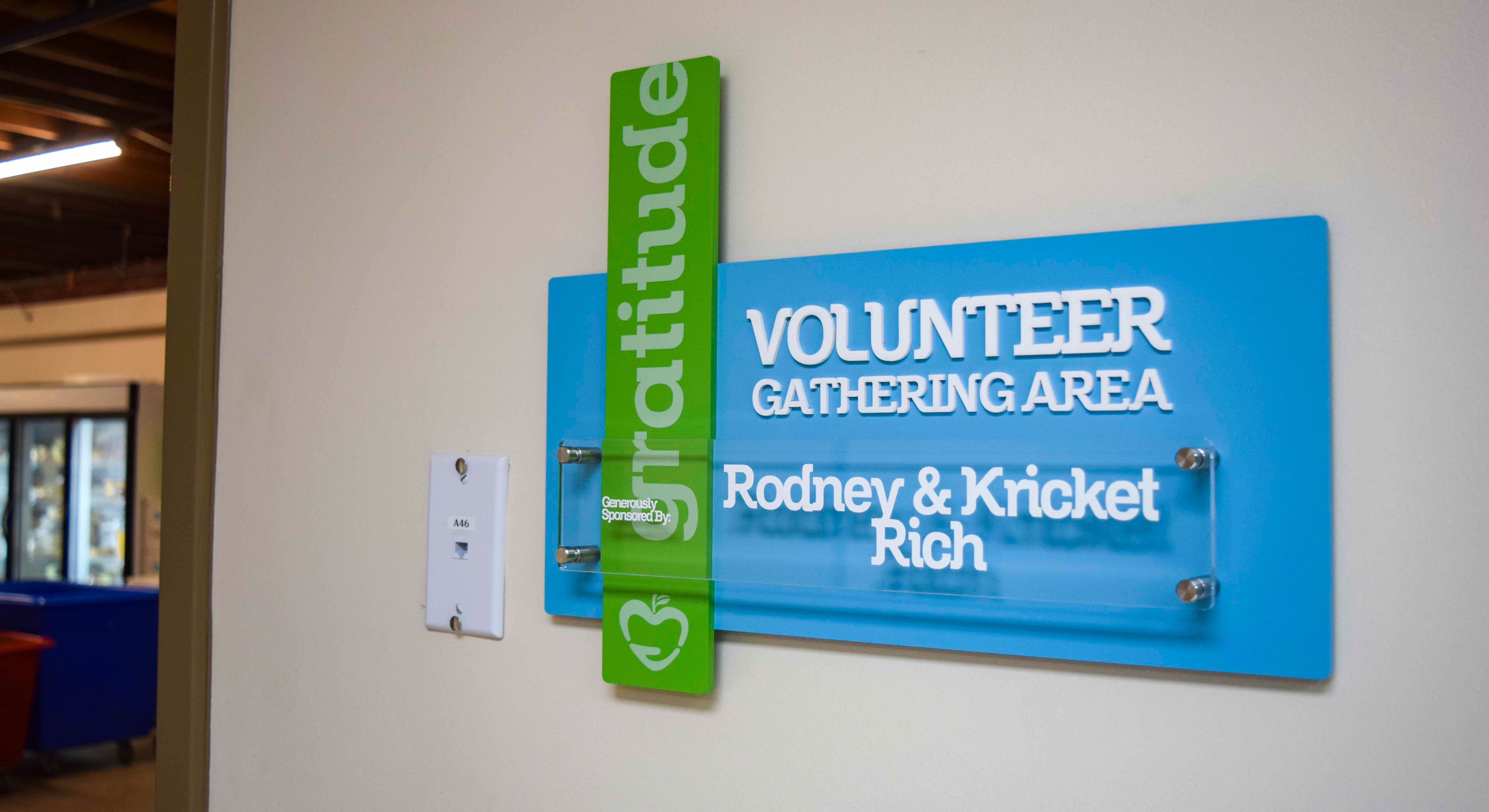 Branded interior donor signage at Manna Food Pantries break room - Signgeek Branded Environments