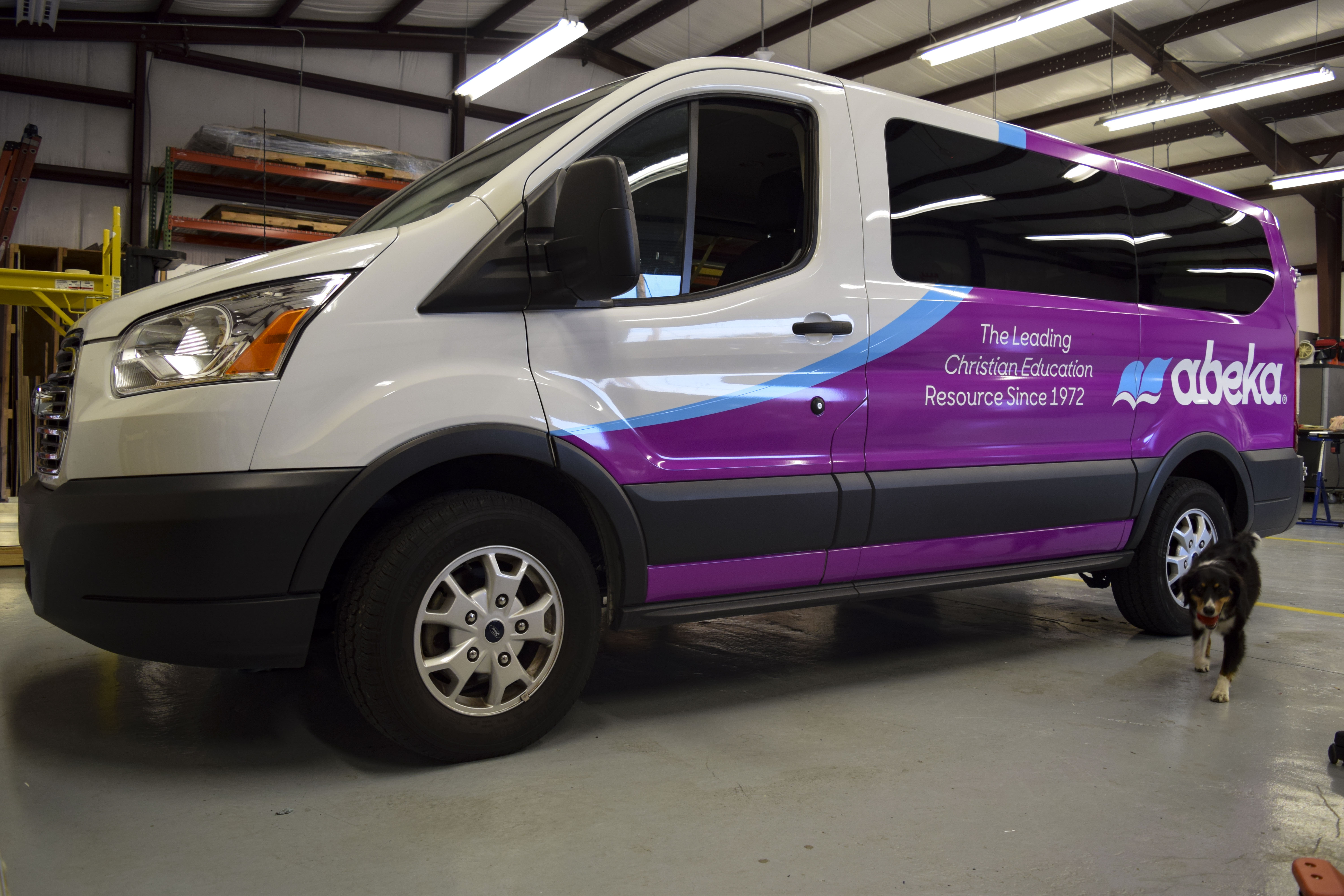 Vinyl wraps on new abeka books vans - signgeek fleet wraps & graphics