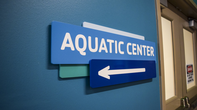 Interior wayfinding signage for the downtown Pensacola YMCA. Manufactured and installed by Signgeek. 