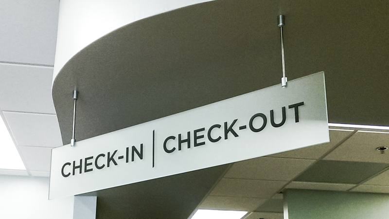 Hanging wayfinding signage for Sacred Heart Medical Group. Built and installed by Signgeek, 