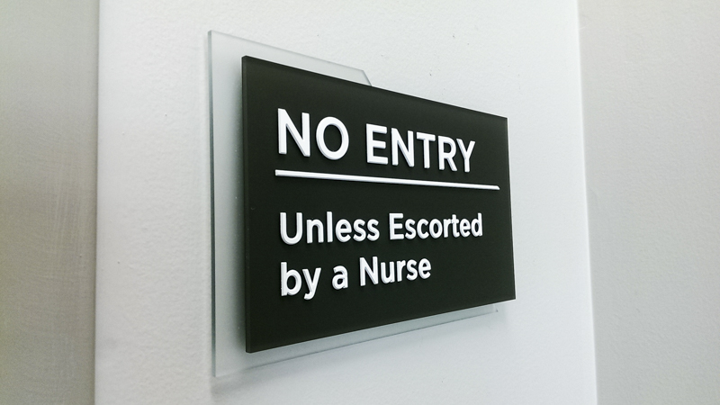 Interior wayfinding signage for Sacred Heart Health System. Built and installed by Signgeek. 