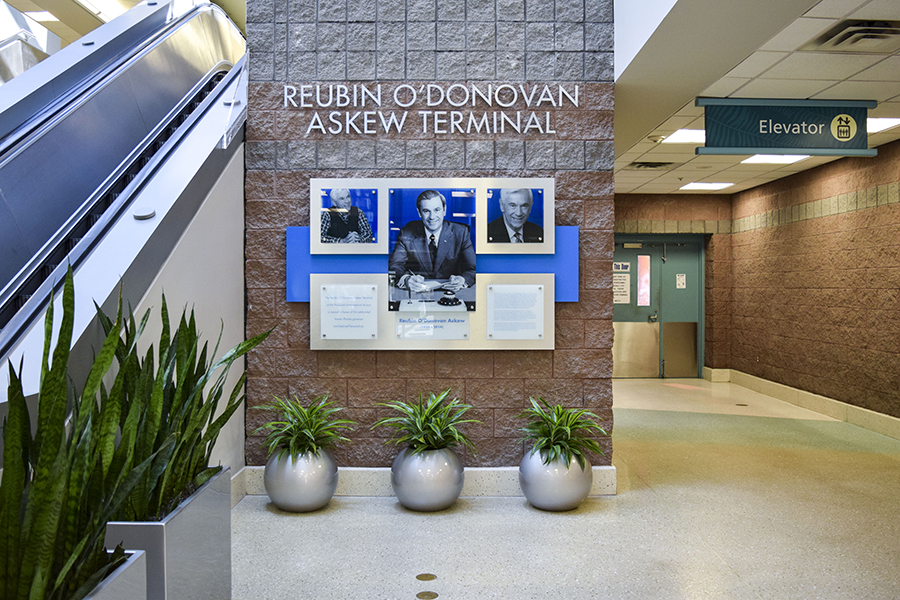 Acrylic standoff wall display at Pensacola International Airport - signgeek Environmental Graphics