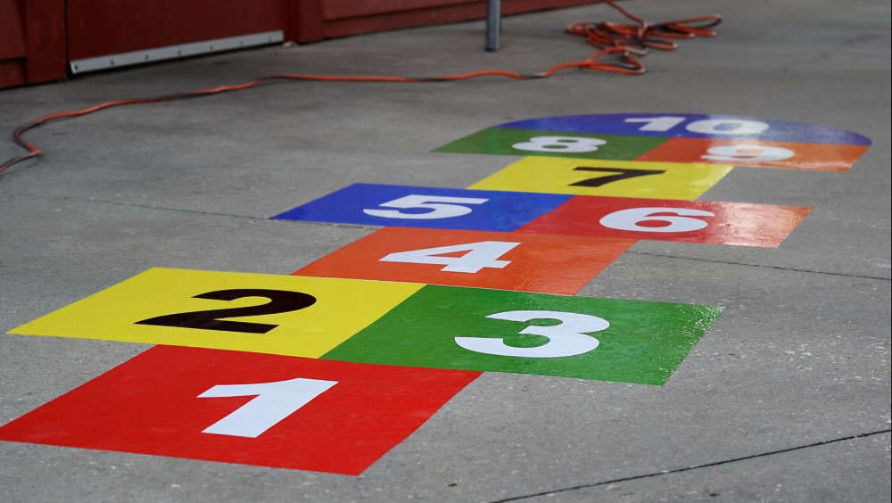 Hopscotch flat graphics at Maritime Community Park - signgeek Environmental Graphics 